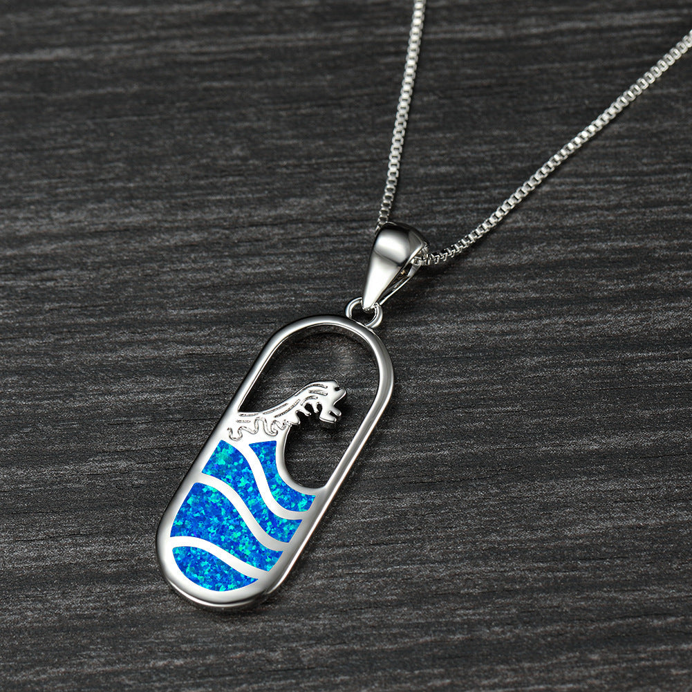 Platinum oval blue sapphire ocean wave necklace
