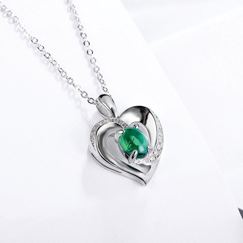 Women's Sterling Silver Channel Setting Hollow Heart Shape Pendant with Oval Brilliant Cut Emerald Gem