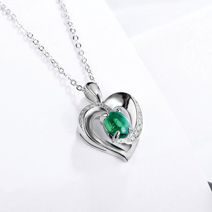 Women's Sterling Silver Channel Setting Hollow Heart Shape Pendant with Oval Brilliant Cut Emerald Gem