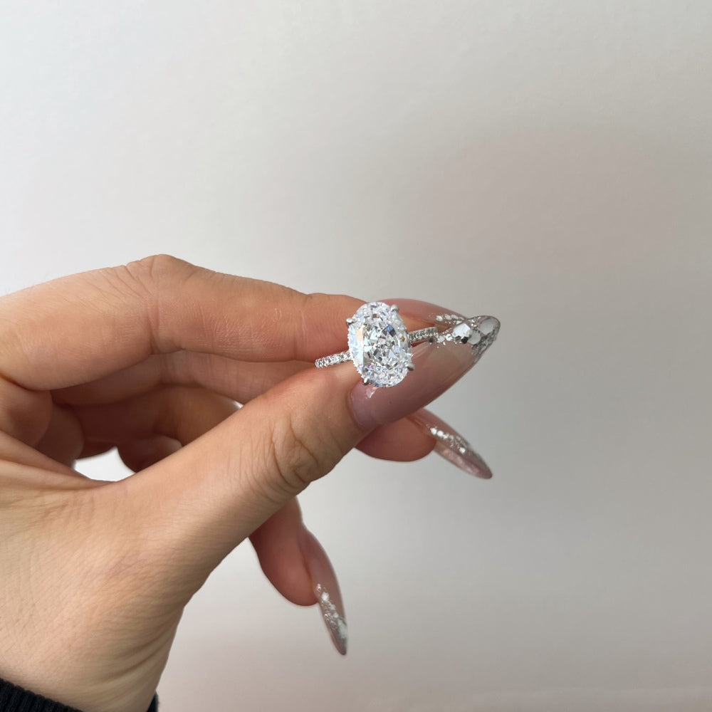Women's Oval Egg Shape Claw Set Solitaire Zirconia Ring with Accent Side Stones, S925 with White Gold Plating