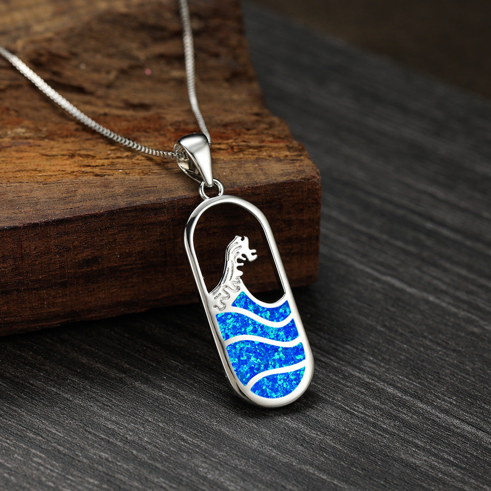 Platinum oval blue sapphire ocean wave necklace